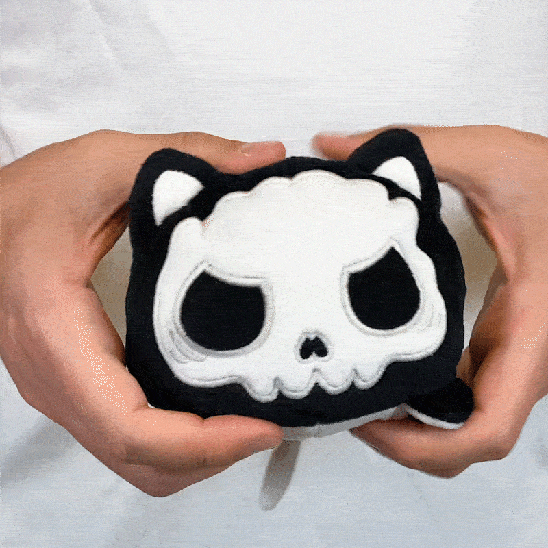 TeeTurtle Reversible Cat Plushie (Skeleton Glow)